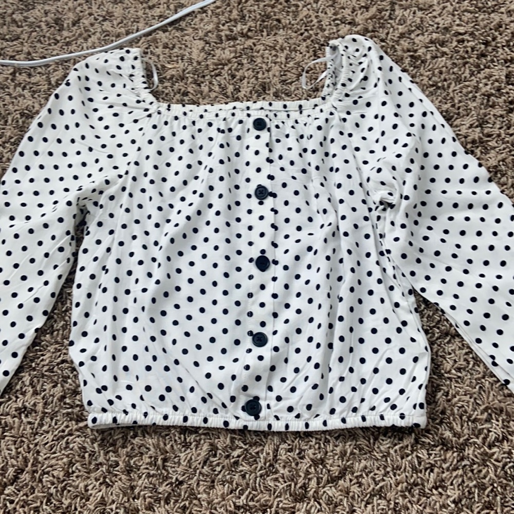 Black and white polka dotted blouse